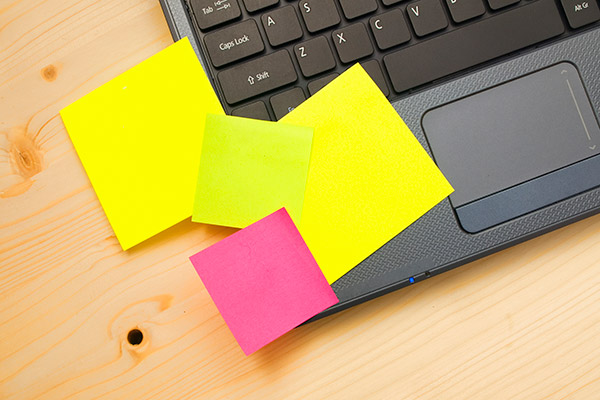 Post It Notes on a laptop